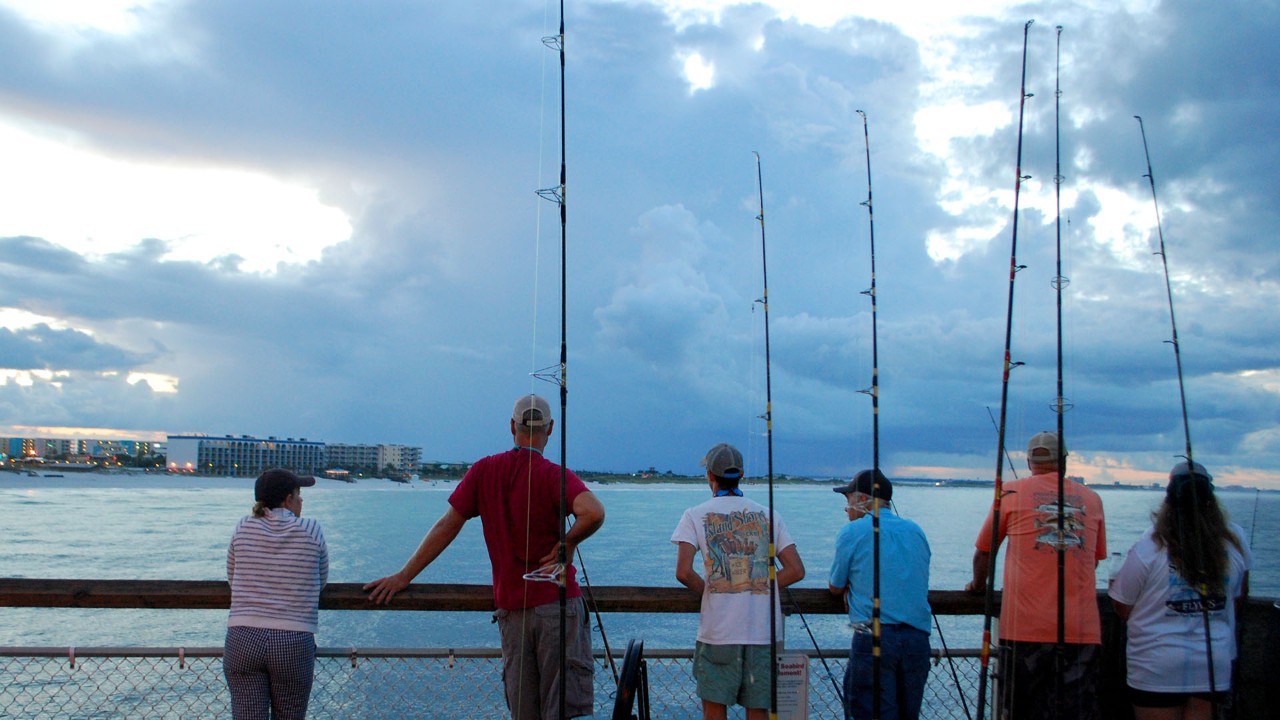 Serious fisherman at sunrise