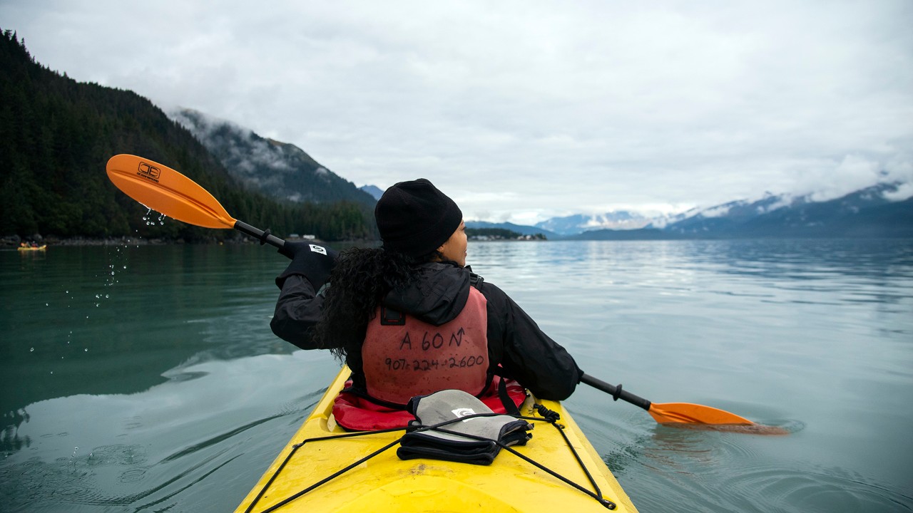 A kayaker paddles to Tonsina Point during a trip with Adventure Sixty North.