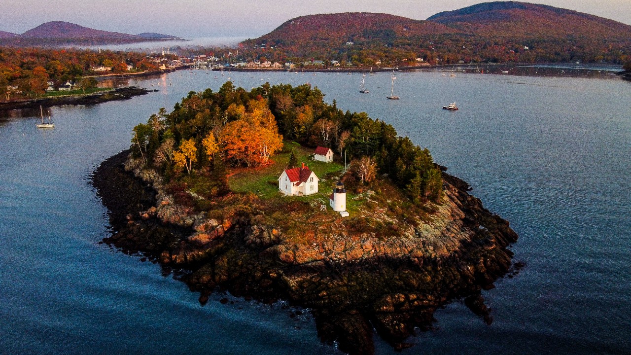 The sunrise illuminates the Curtis Island Lighthouse off the coast of Camden. 