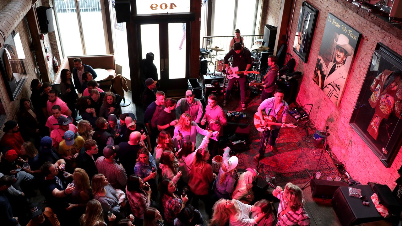Partiers fill the floor at Nudie's nightclub in Nashville.