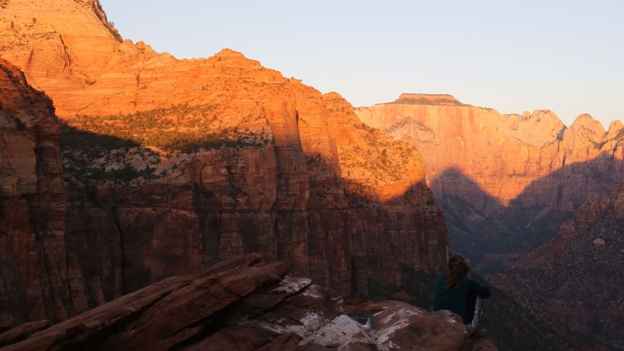 The sun rises on the Canyon Overlook Trail.