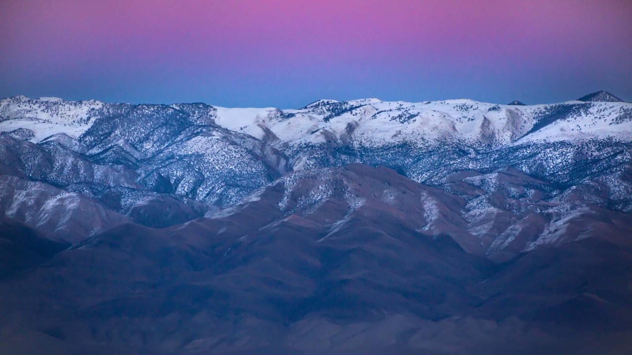 The sun sets along State Route 186.